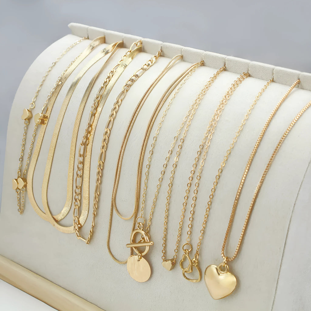 Gold women's 10-piece necklace set with alloy pendant on an adjustable snake bones chain.