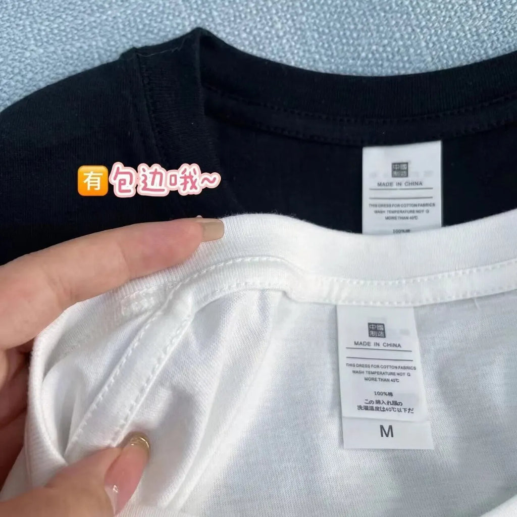 Men's white cotton T-shirt with simple cartoon print showing loose fit and short sleeves
