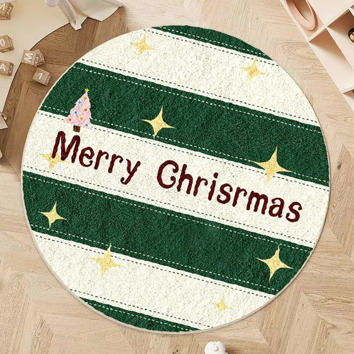 A round alien-shaped Christmas floor mat in imitation cashmere, shown in a festive colour pattern.