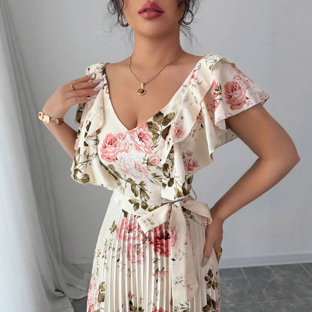 Apricot colour floral print V-neck dress with ruffled short sleeves and a pleated high-waist swing skirt.