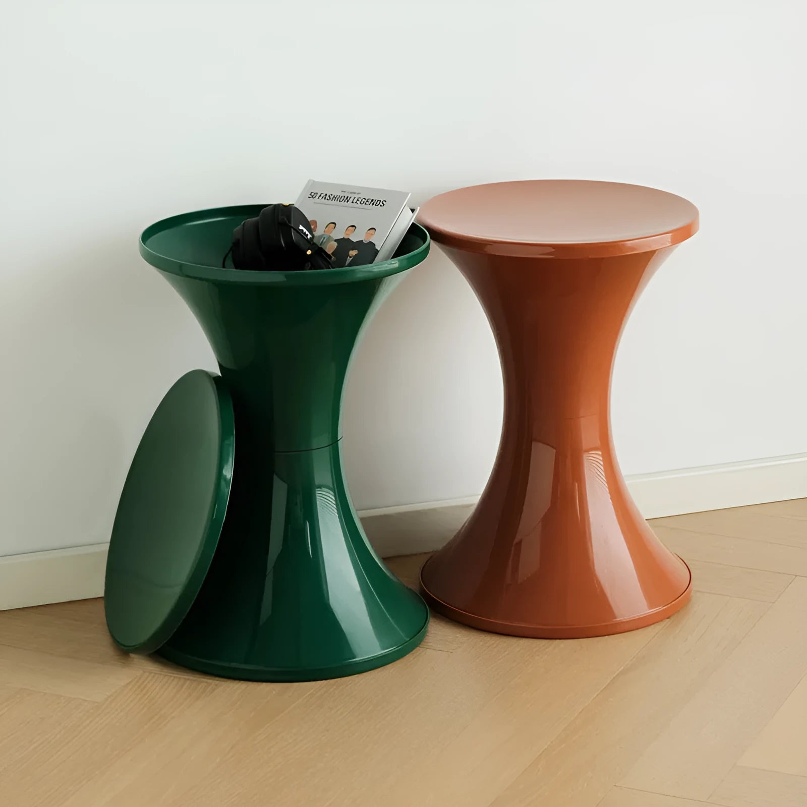 A plastic hourglass-style shoe changing stool, shown in one of the available colours.