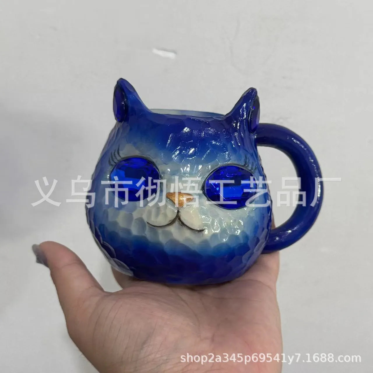 Resin cat cup ornament with crystal earth design in blue, green, pink, or purple colour options.