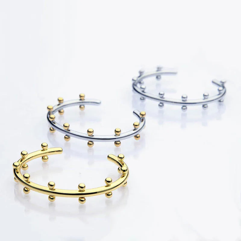 Stainless steel C-shaped bean bead with textured rivet detail for jewellery making