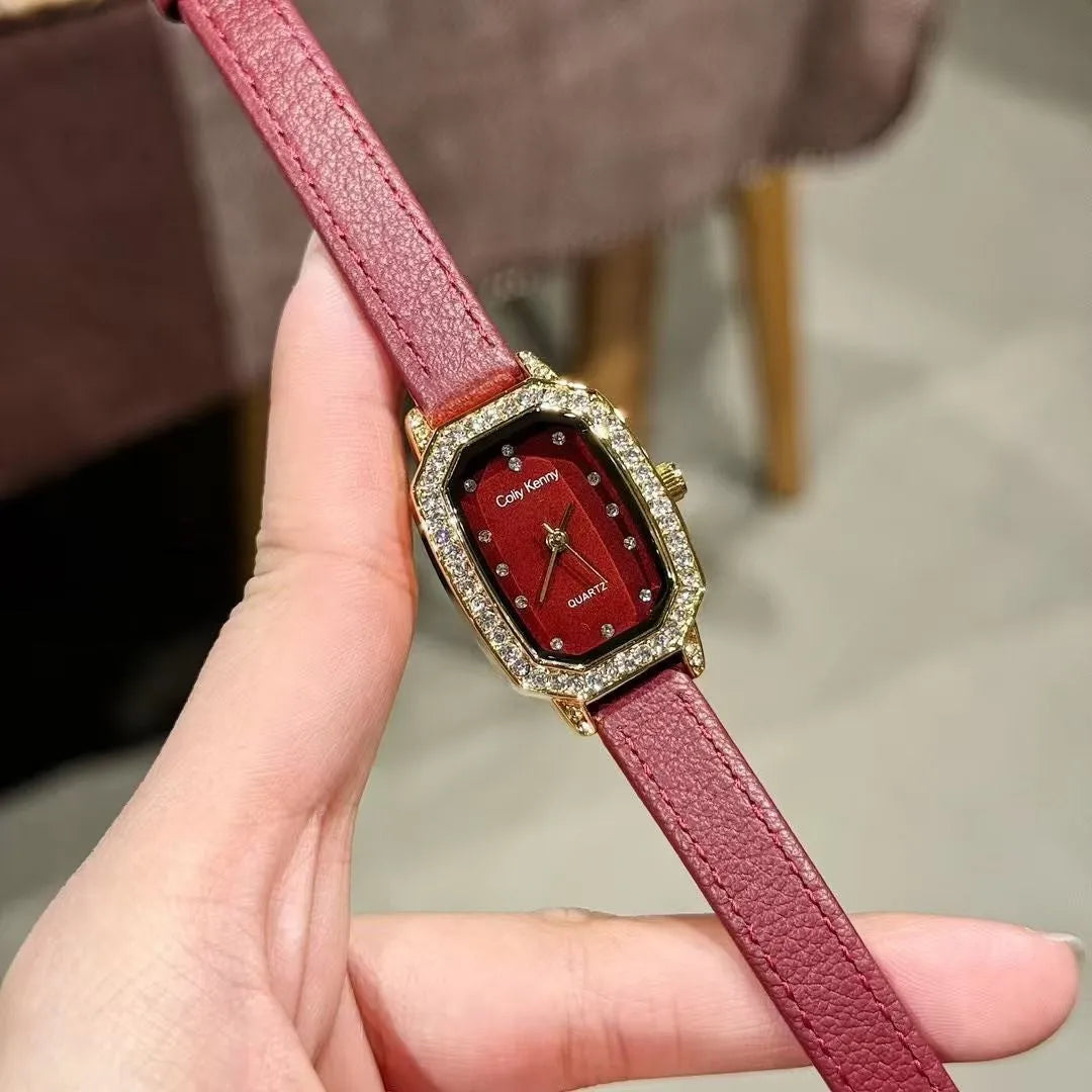 Chinese style red alloy women's wristwatch with a decorative dial on a 8mm thick case.