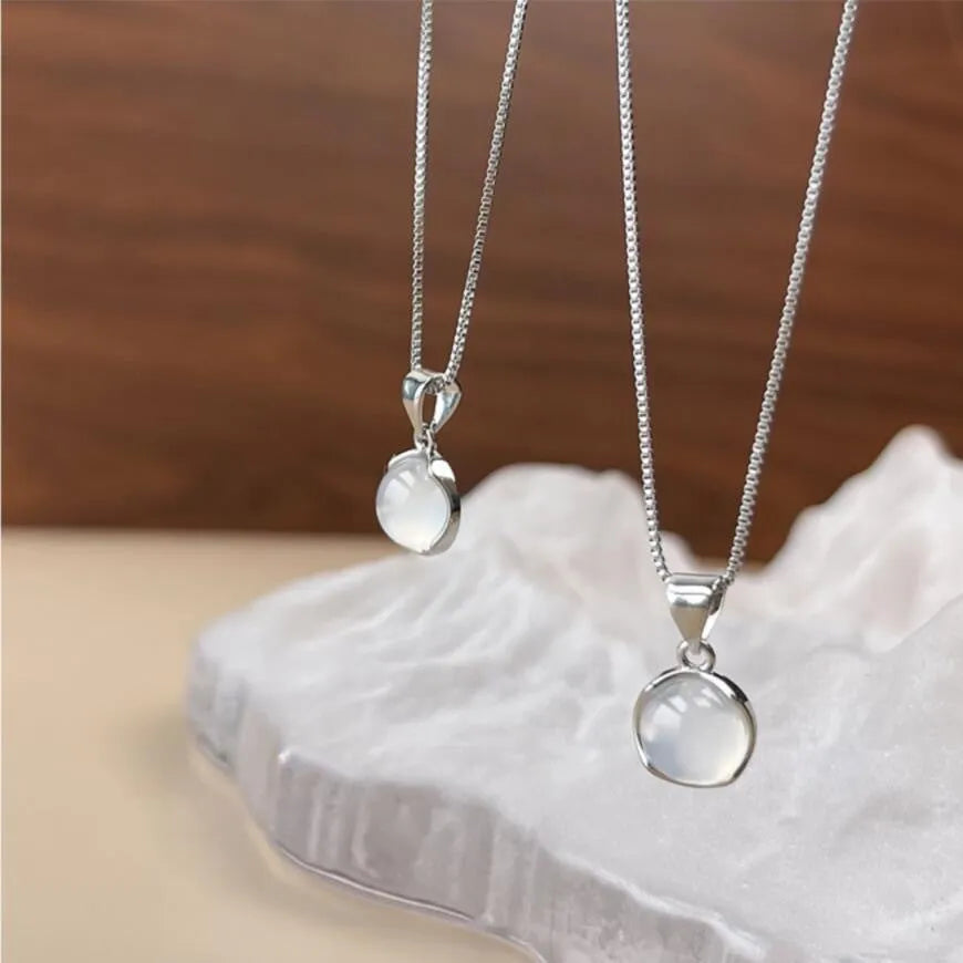 Women's Korean-style oval artificial crystal star pendant necklace on an adjustable box chain.