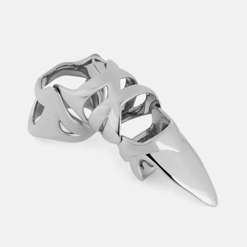 Silver punk armour finger stall with large geometric cutout on a model's finger.