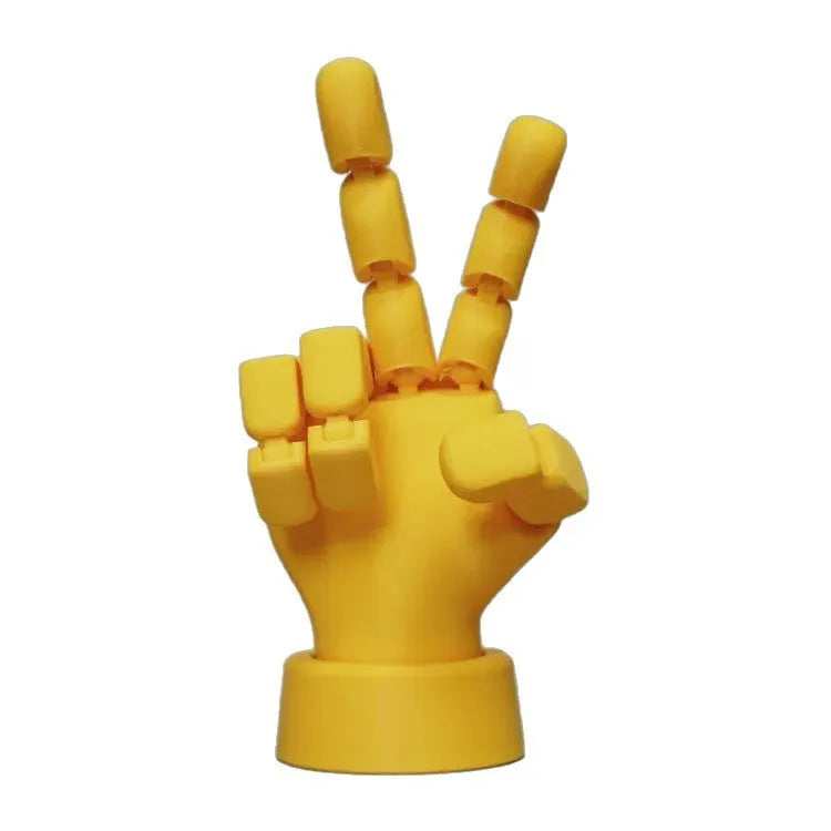 Yellow movable joint hand ornament figurine made of PLA plastic on a plain background