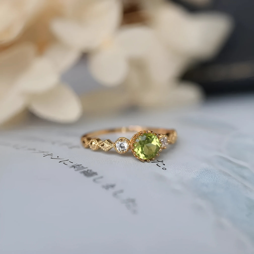 Copper ring with a green quadrilateral imitation peridot stone in a geometric Japanese retro style.