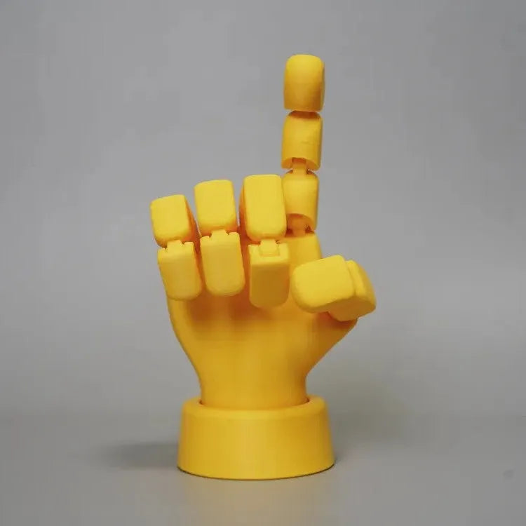 Yellow movable joint hand ornament figurine made of PLA plastic on a plain background