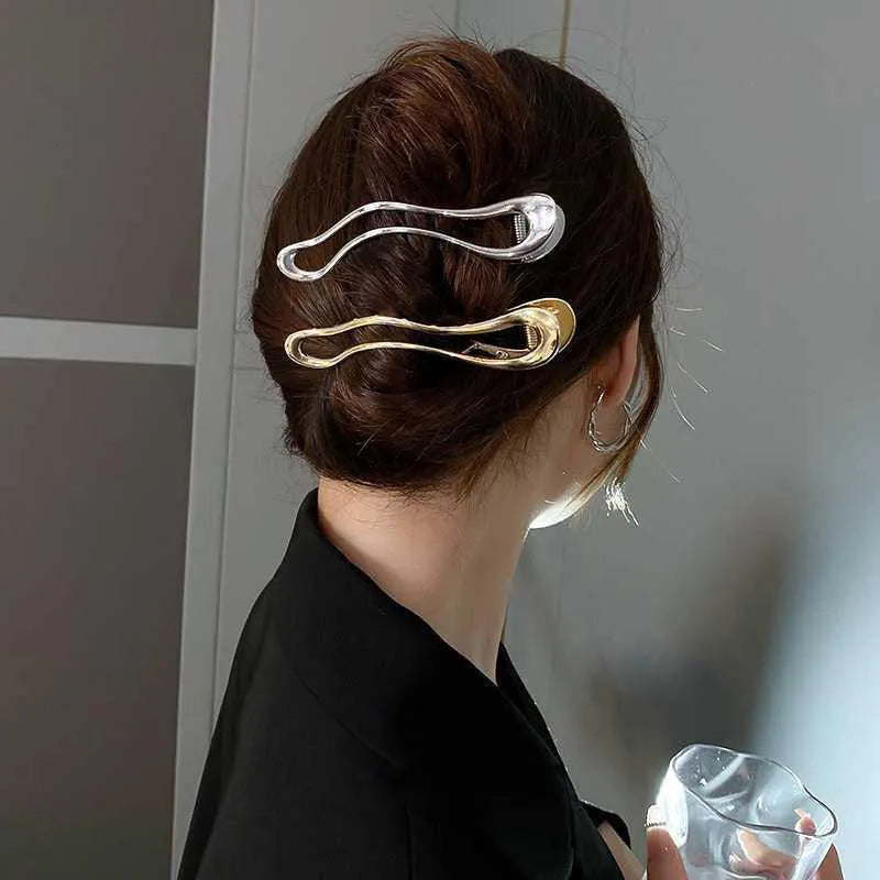 Gold and silver zinc alloy barrettes in square, arc, and triangle shapes for women.