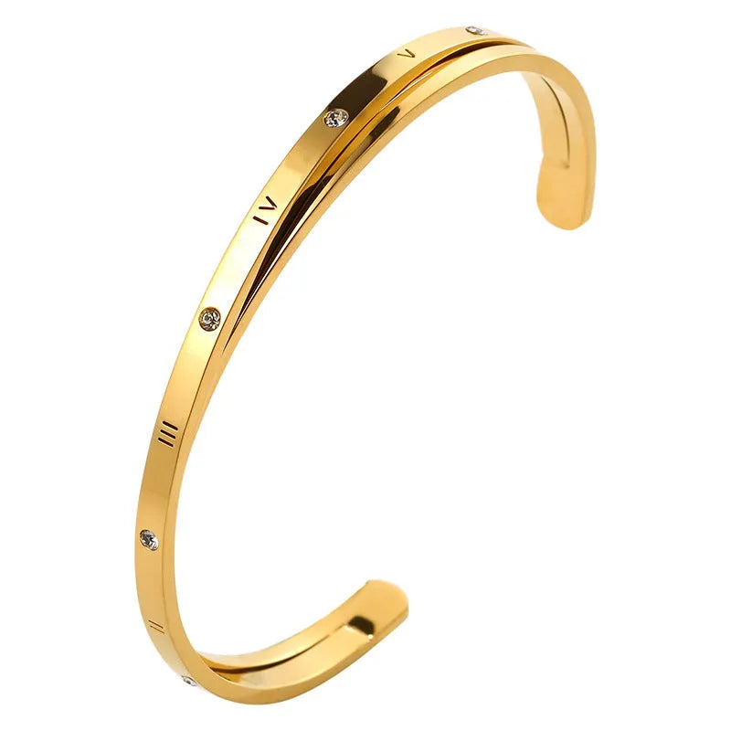 Open-ended stainless steel bracelet with inlaid zircon stones in a love-themed design, shown in rose gold colour.