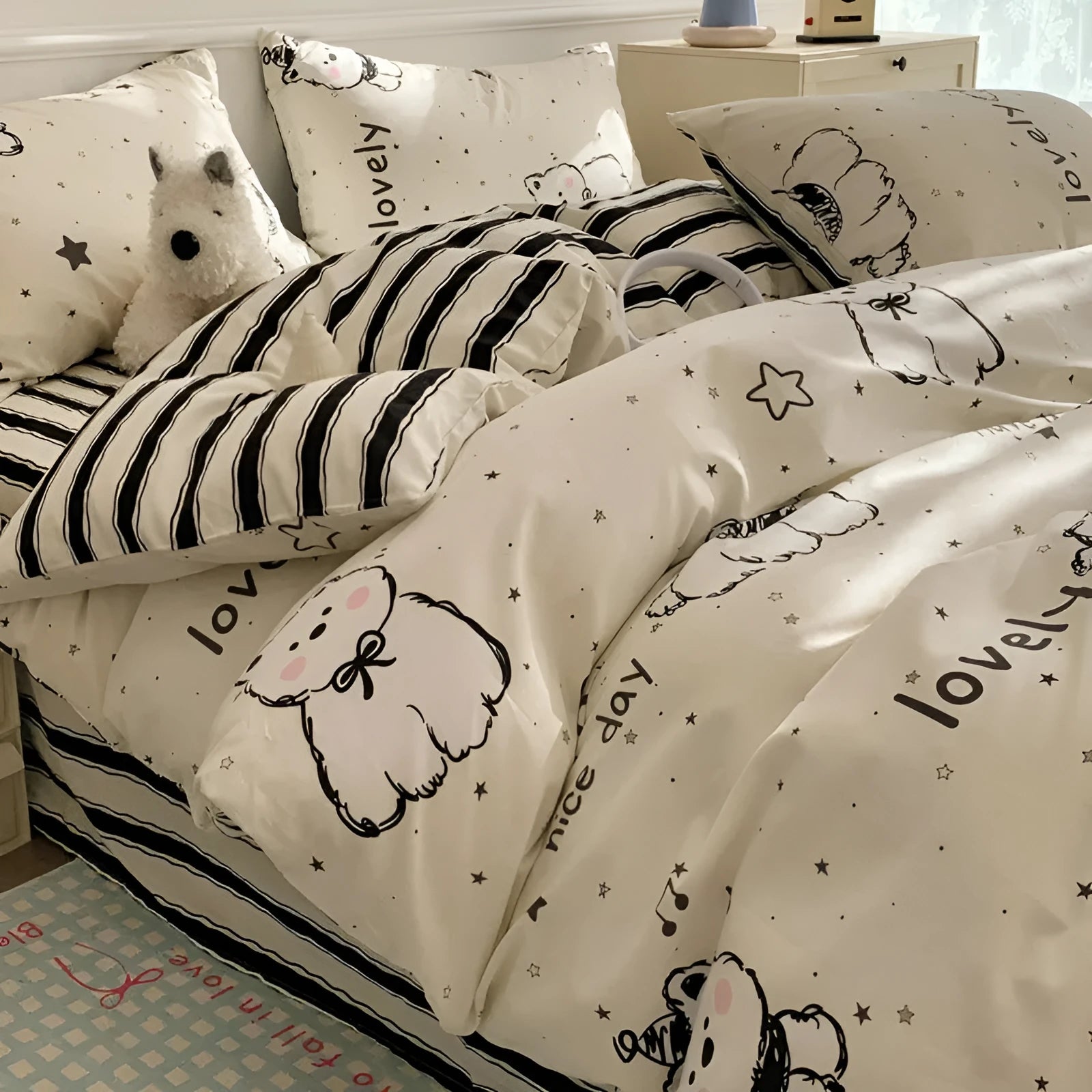 Cartoon dog pattern on a pure cotton duvet cover and pillowcase set, laid on a bed.