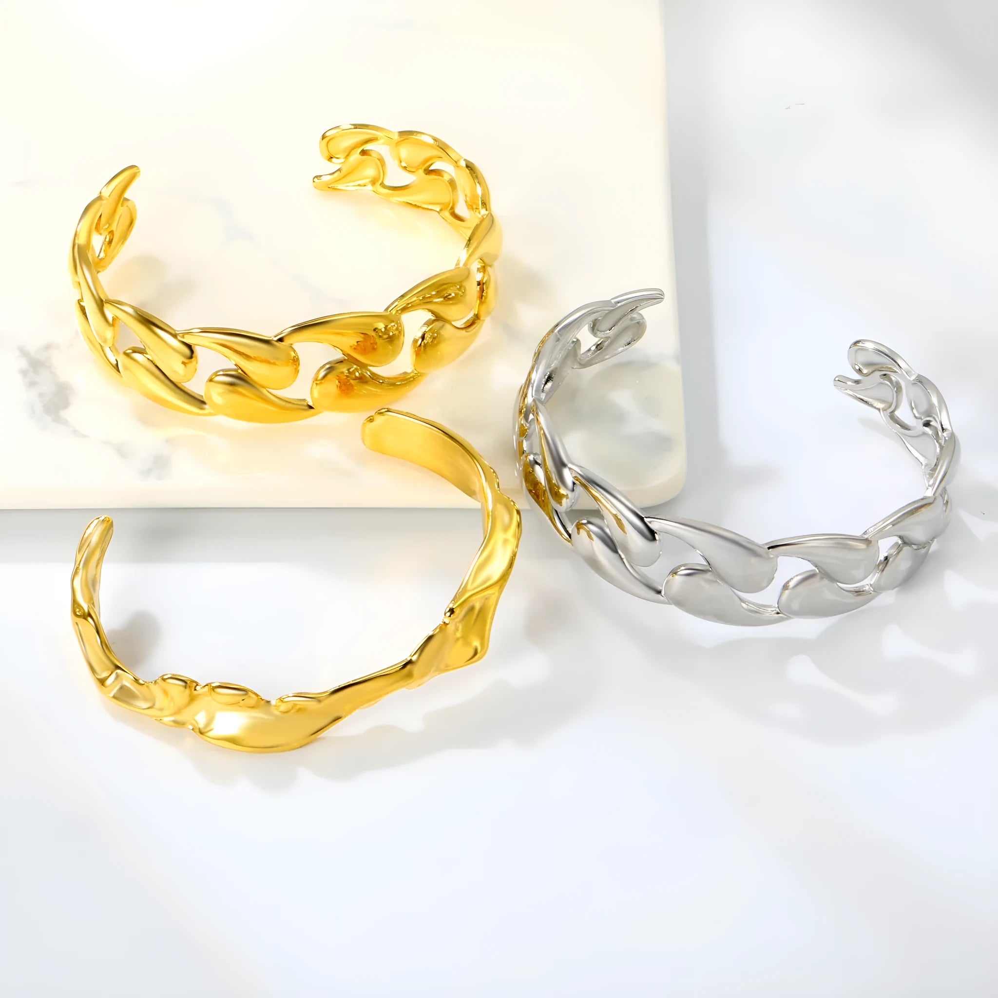 Stainless steel advanced style bracelet in one of three colour options on a white background.