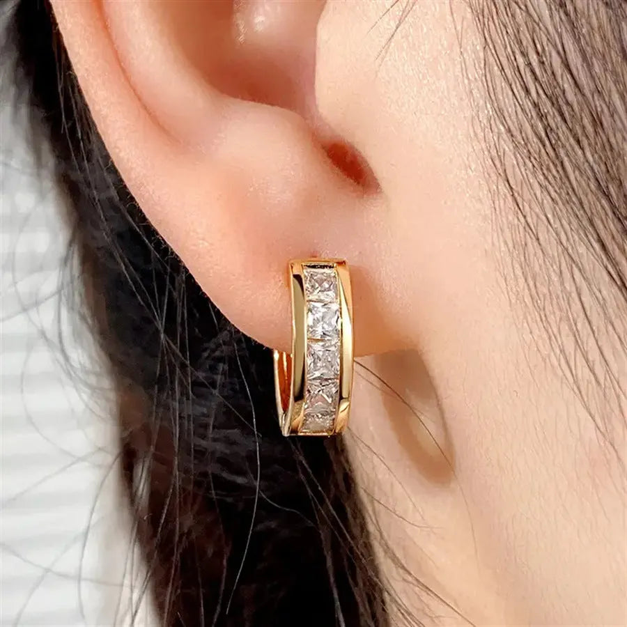 Geometric quadrilateral copper earrings for women in a gold colour finish.