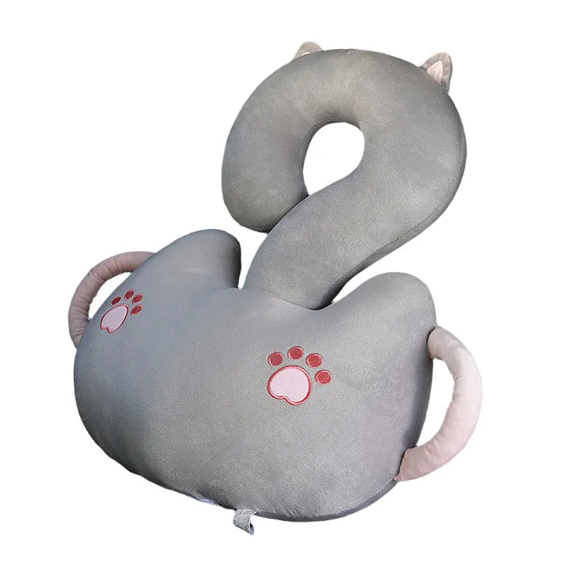 Square cartoon question mark shaped cushion with animal print, shown in light cat colour for scale.