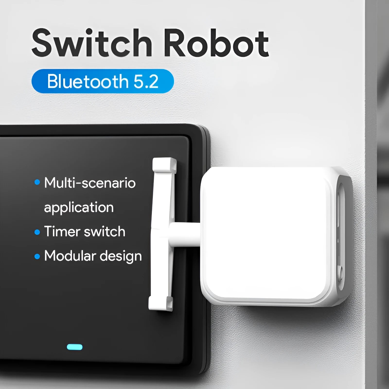 Small white Bluetooth finger remote with rocker arm switch, shown on a person's thumb.
