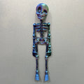3D printed white skull fridge magnet ornament measuring 18cm tall on a refrigerator door.