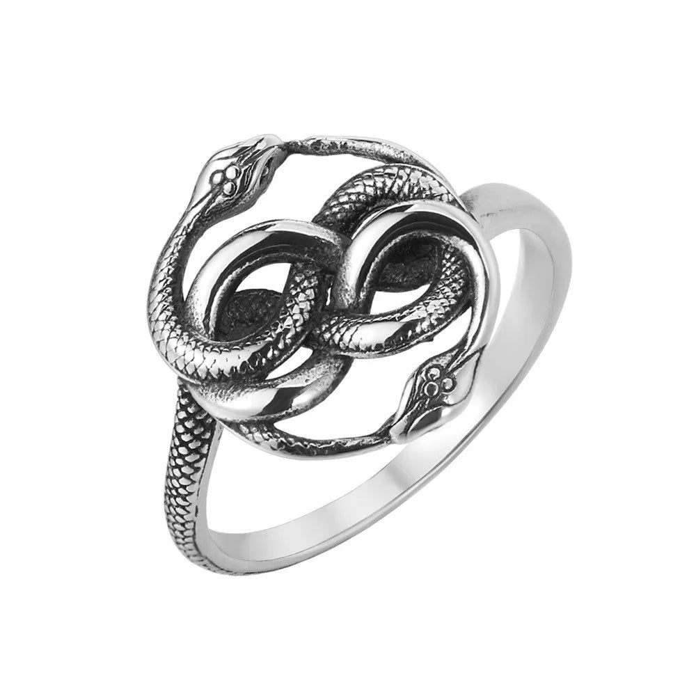 Close-up of a retro double snake coil ring in steel colour titanium steel on a model's hand.