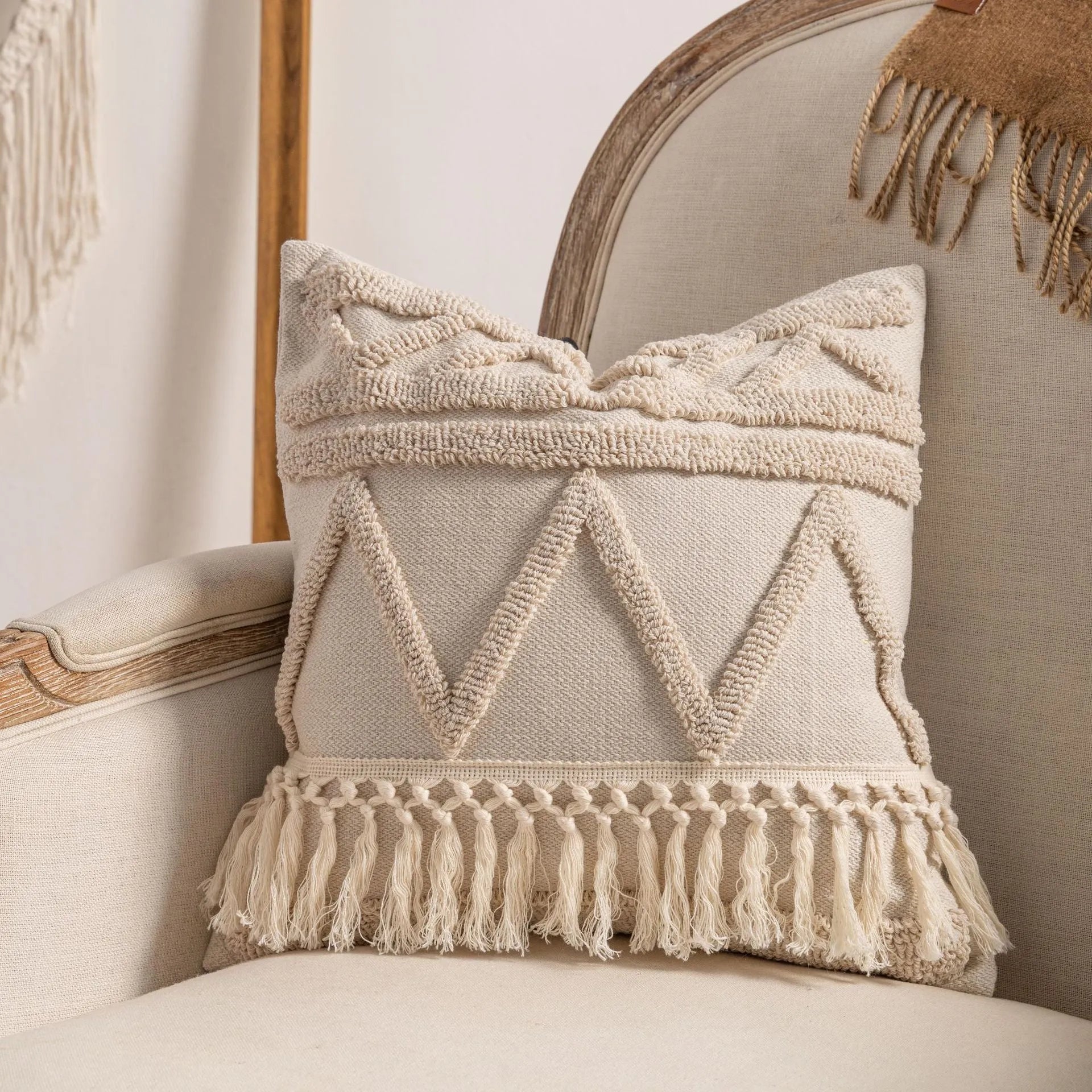 Knitted decorative cushion cover with tassel fringe in spiral dots pattern showing 45x45cm size