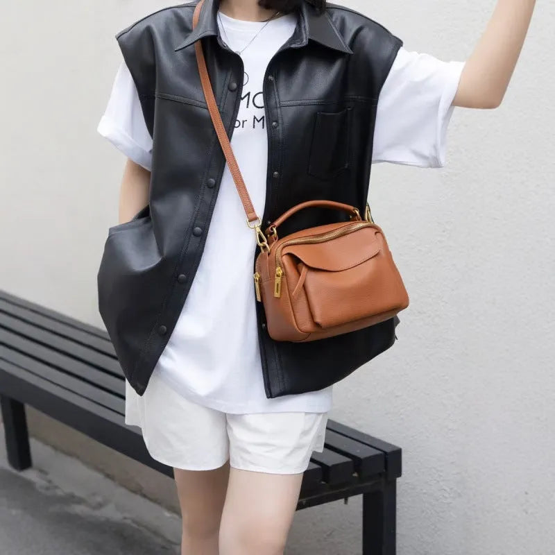 Genuine leather multi-compartment shoulder handbag in almond white with sewing thread detail and outer sandwich pocket