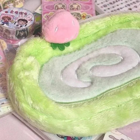 A plush velvet pencil case designed like a Swiss roll cake, in a Korean style.
