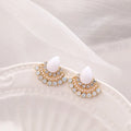 Women's silver fan-shaped stud earrings with rhinestone details on a geometric alloy setting.