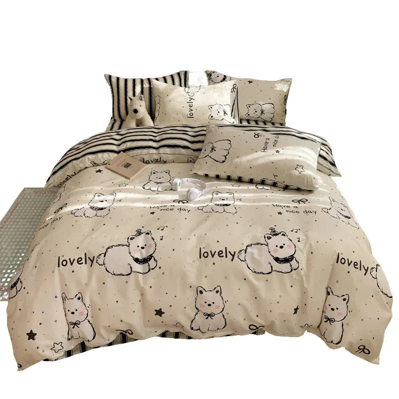 Cartoon dog pattern on a pure cotton duvet cover and pillowcase set, laid on a bed.