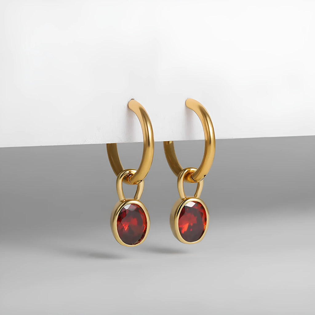 Close-up of women's simple oval zircon stud earrings in copper, showing army green and emerald colour options on a white background.