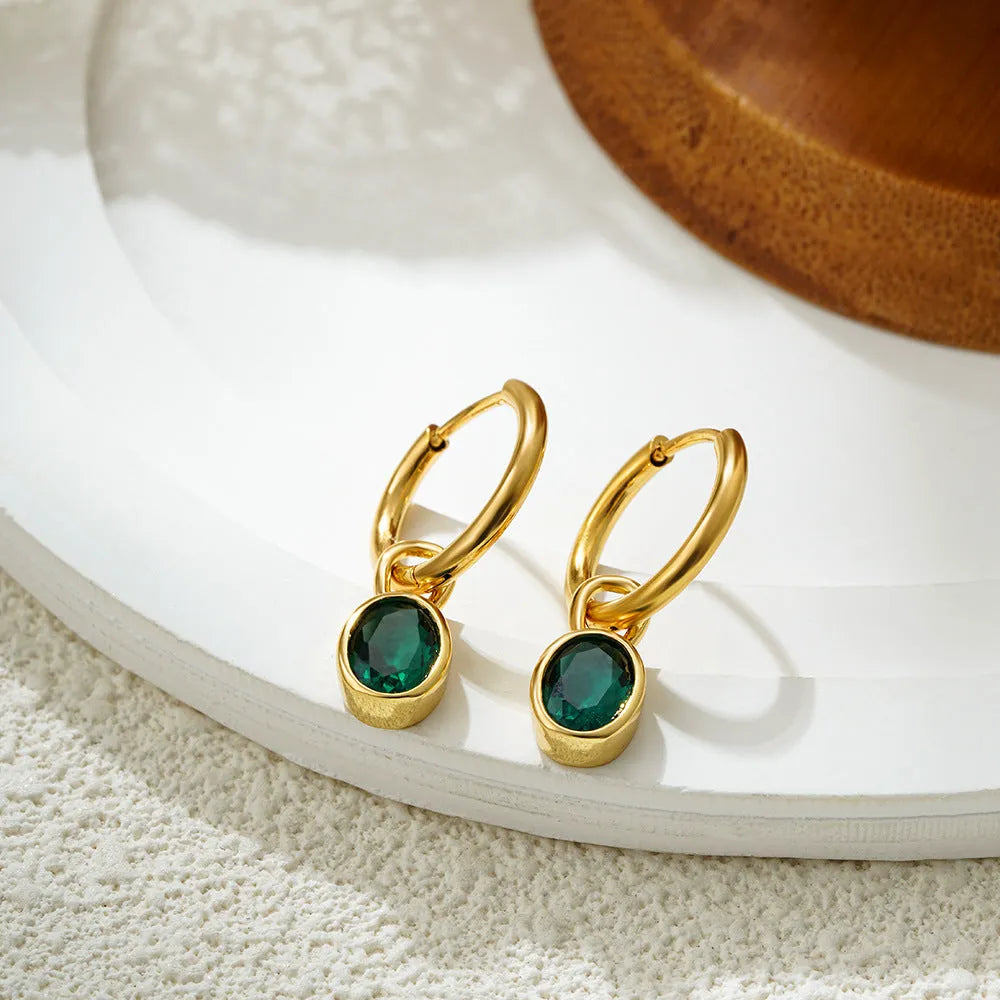 Close-up of women's simple oval zircon stud earrings in copper, showing army green and emerald colour options on a white background.