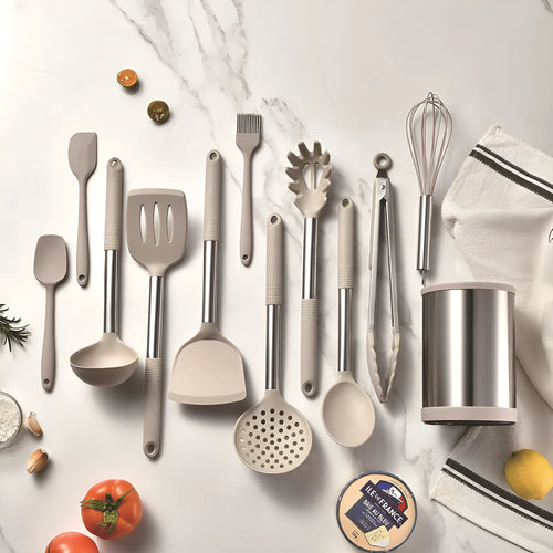 Black silicone kitchen utensil set with 12 tools in a rotating storage bucket on a kitchen countertop