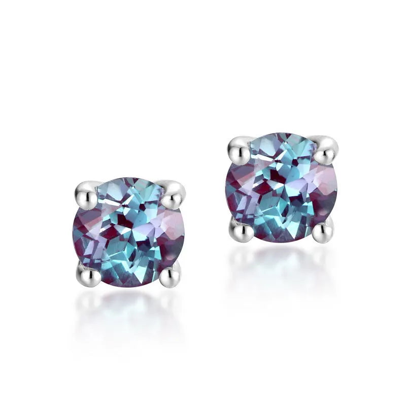 A pair of silver geometric ear studs with a round, coloured Alexander stone setting.