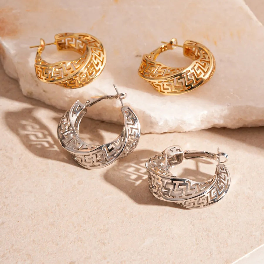 Women's geometric hollow stud earrings with twisted round design in gold and silver options