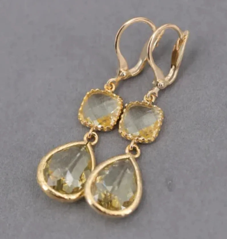 Gold geometric earrings with long crystal fringe and water droplet design on copper base