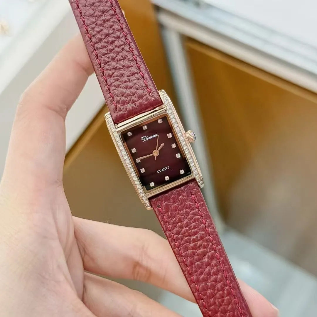 Chinese style red alloy women's wristwatch with a decorative dial on a 8mm thick case.