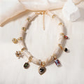 Women's bamboo design heart-shaped resin pendant necklace with electroplated finish.