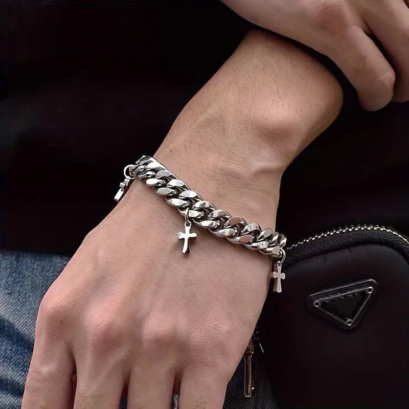 Men's titanium steel bracelet with geometric shape and cross design detail.