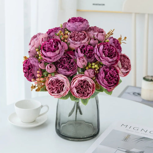 Artificial silk peony bouquet in a vase, showing realistic pink and champagne coloured blooms for home decor.