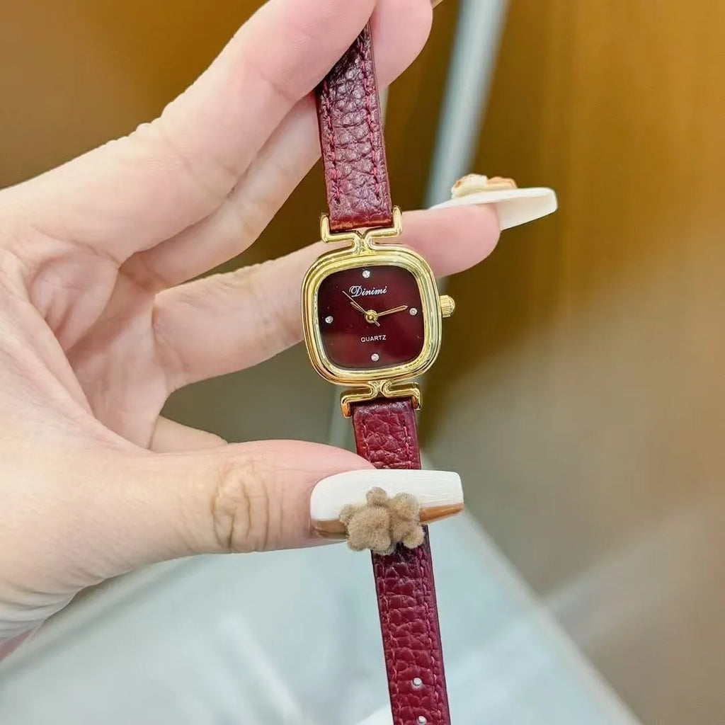 Chinese style red alloy women's wristwatch with a decorative dial on a 8mm thick case.