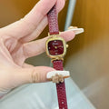 Chinese style red alloy women's wristwatch with a decorative dial on a 8mm thick case.