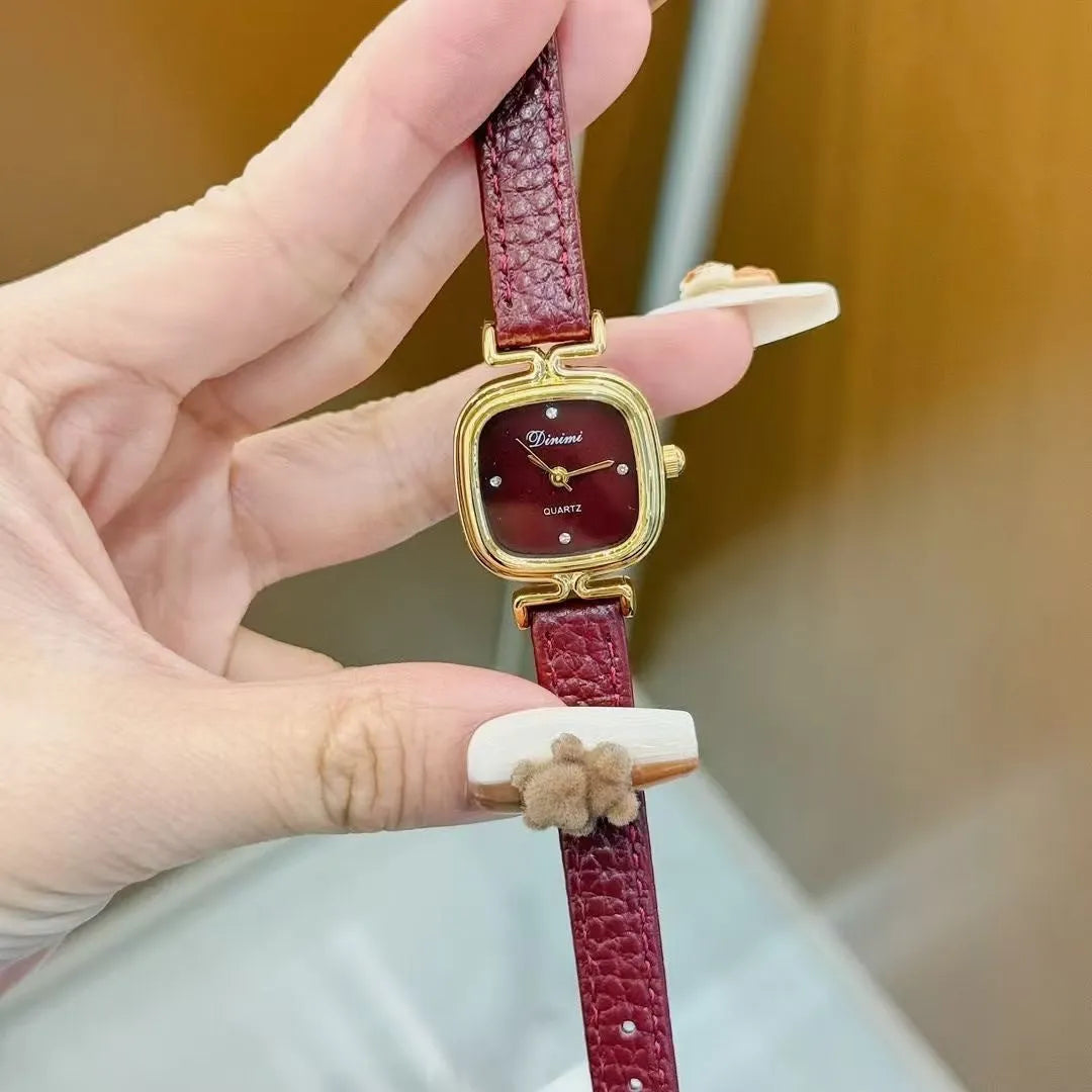 Chinese style red alloy women's wristwatch with a decorative dial on a 8mm thick case.