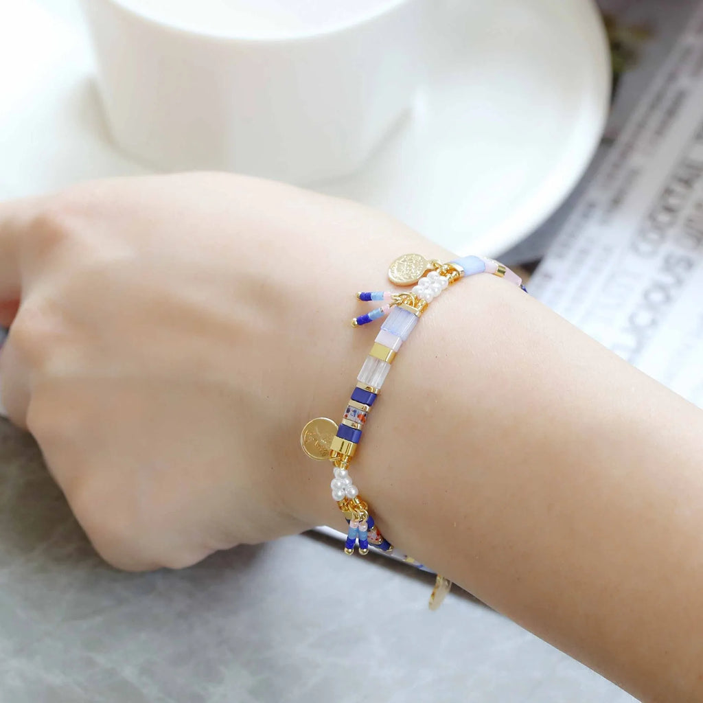 Handcrafted women's beaded bracelet with glass and imitation pearl elements in six colour styles