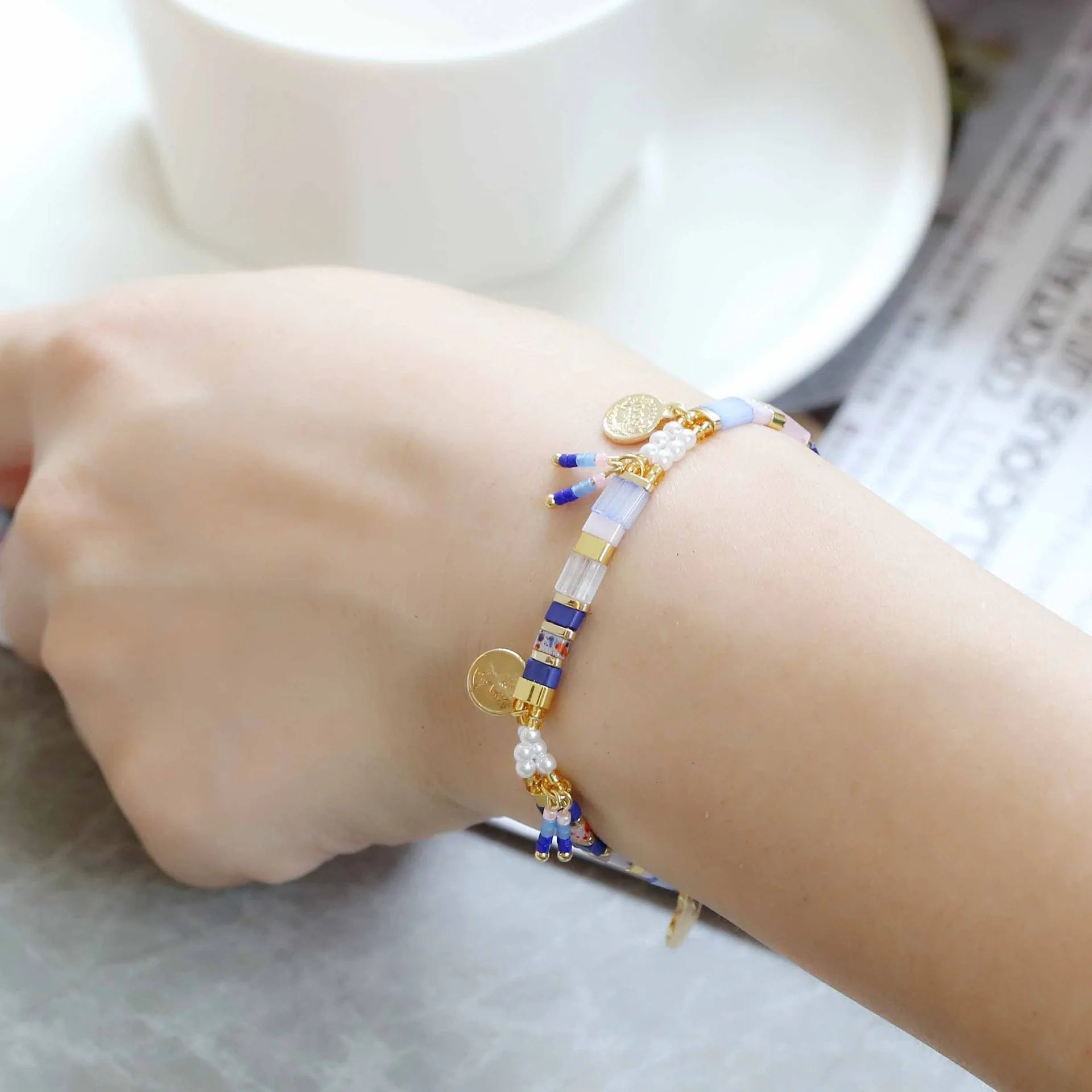 Handcrafted women's beaded bracelet with glass and imitation pearl elements in six colour styles