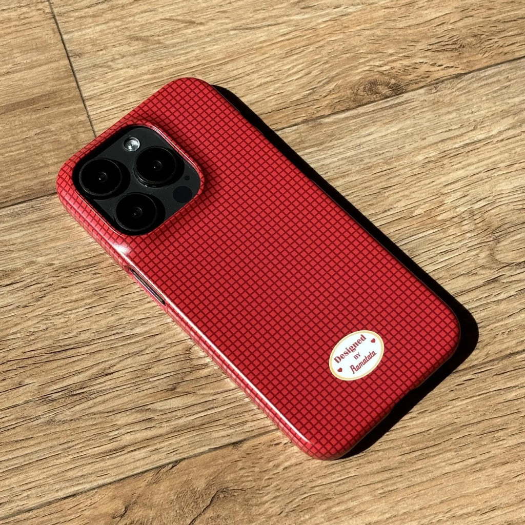 Red and orange plaid iPhone 15 Pro Max phone case with glossy and frosted finish options.