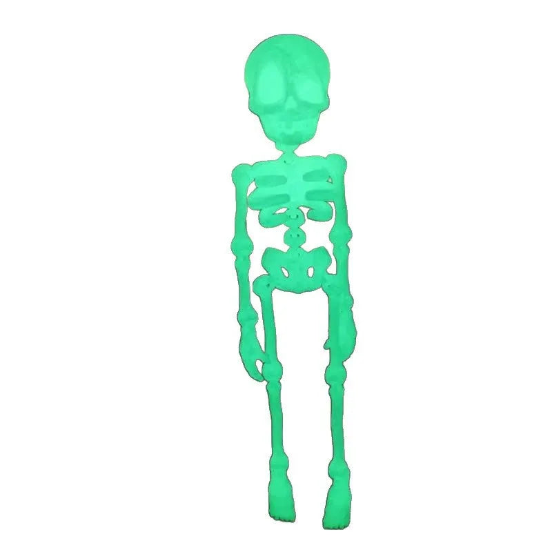 3D printed white Halloween skull refrigerator magnet ornament on a metallic surface.