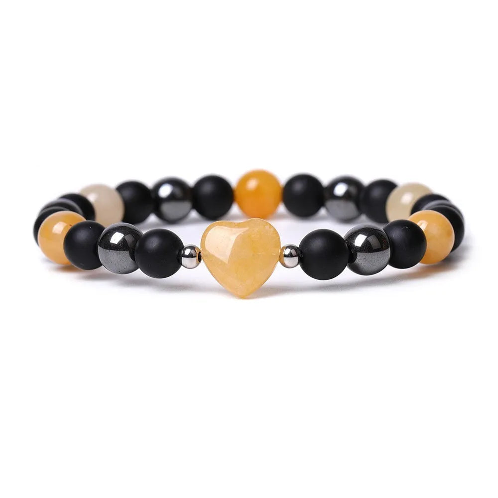 Lvdongling stone bracelet with hand-cut peach heart charm and planetary charms in tigereye colour