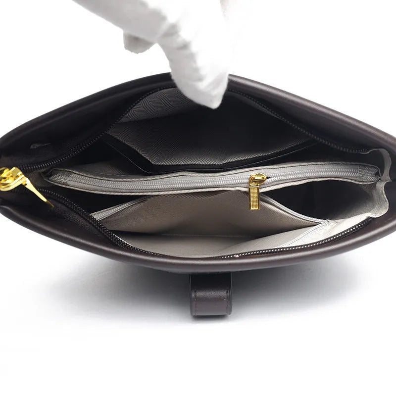 Korean style black PU bucket messenger bag with dual shoulder straps and internal organiser compartments