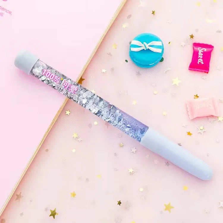Luminous glitter quicksand neutral pen with 0.5mm fine tip in fairy wand blue colour showing flowing glitter inside clear plastic barrel