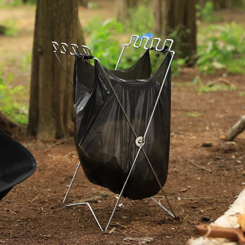 Stainless steel folding garbage bag bracket in collapsed position showing silver finish