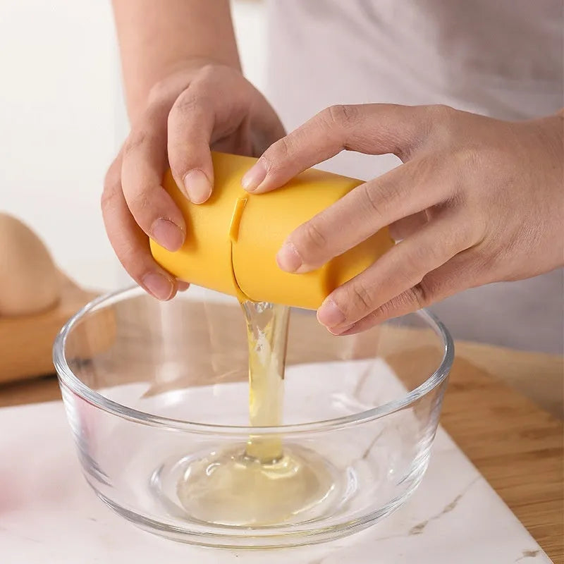 Colourful egg shell opener and beater kitchen tool made of stainless steel and plastic on a kitchen counter.