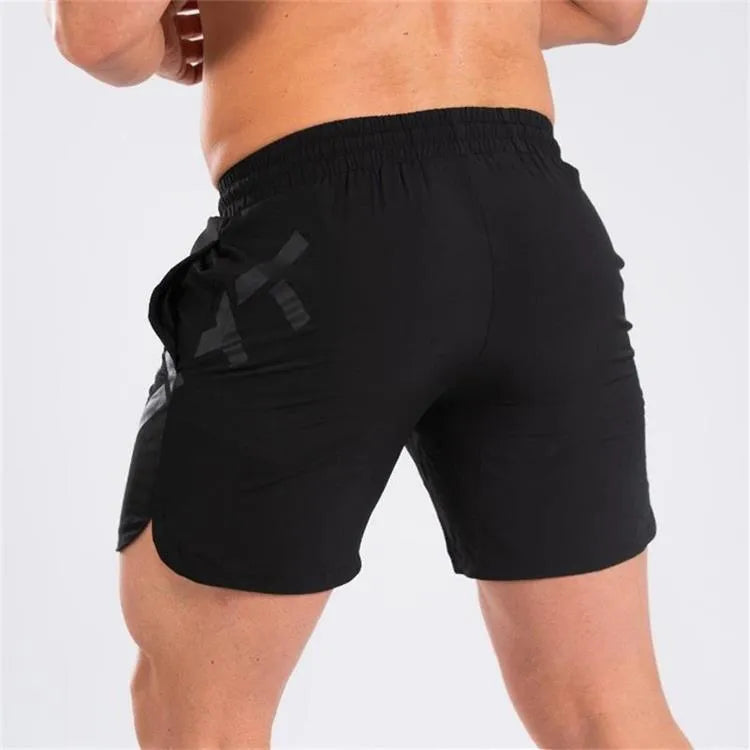 Men's black elastic training running shorts with knee-length cut and quick-dry fabric